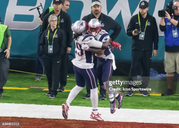 New England Patriots running back LeGarrette Blount hugs New England Patriots running back James White for scoring the winning touchdown in overtime...