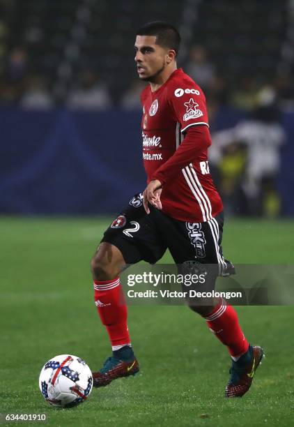 John Requejo of Club Tijuana plays the ball through midfield during the friendly match against the Los Angeles Galaxy at StubHub Center on February...