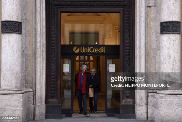 Costumers leave a branch of the Unicredit bank in downtown Rome on February 09, 2017. UniCredit S.p.A. Is an Italian global banking and financial...