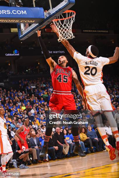 Denzel Valentine of the Chicago Bulls drives to the basket against the Golden State Warriors on February 8, 2017 at ORACLE Arena in Oakland,...