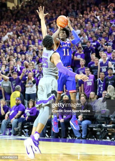 Kansas Jayhawks guard Josh Jackson makes a three overKansas State Wildcats forward Wesley Iwundu early in the second half of the Big 12 showdown...