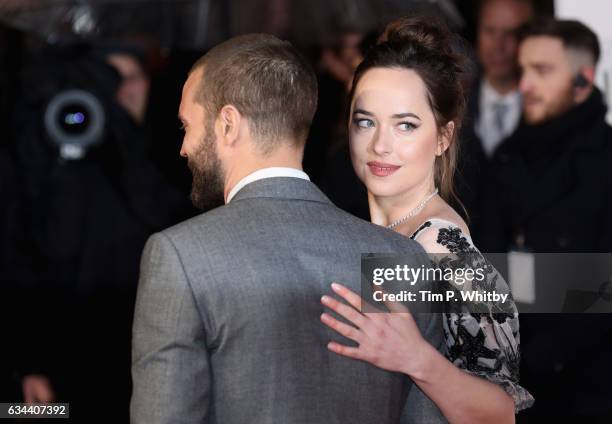 Dakota Johnson and Jamie Dornan attend the UK Premiere of "Fifty Shades Darker" at the Odeon Leicester Square on February 9, 2017 in London, United...