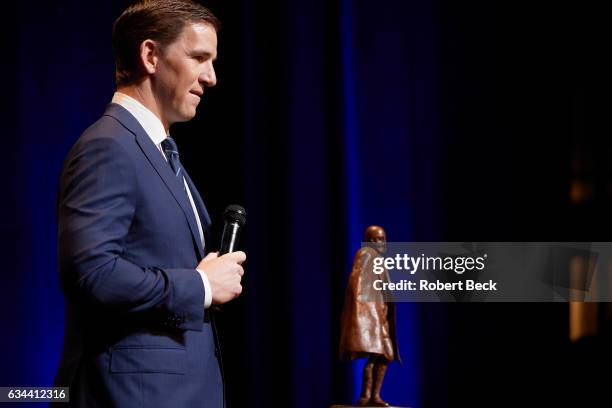 Closeup of New York Giants quarterback Eli Manning on stage during award ceremony at Wortham Theater. Manning was a co-recipient of the Walter Payton...