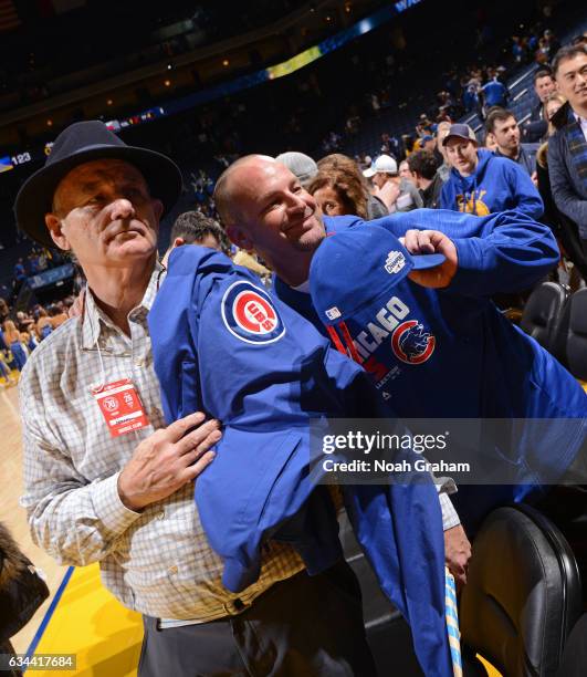 Actor, Bill Murray poses for a photo with a Chicago Cubs fan after the Chicago Bulls game against the Golden State Warriors on February 8, 2017 at...