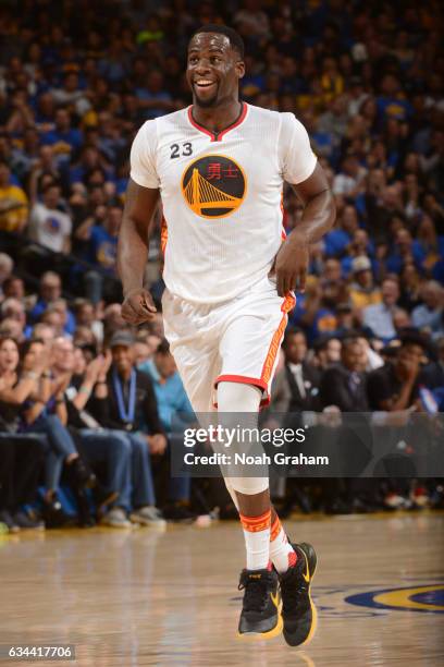 Draymond Green of the Golden State Warriors smiles and runs up court during the game against the Chicago Bulls on February 8, 2017 at ORACLE Arena in...