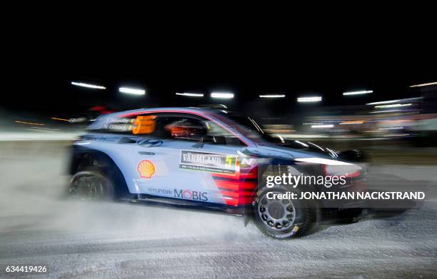 Thierry Neuville of Belgium and his co-driver Nicolas Gilsoul compete in their Hyundai i20 Coupe WRC during the 1st stage of the Rally Sweden, second...