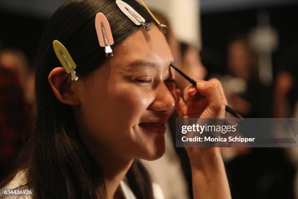 Model prepares backstage at Noon by Noor fashion show during New York Fashion Week: The Shows at Gallery 3, Skylight Clarkson Sq on February 9, 2017...