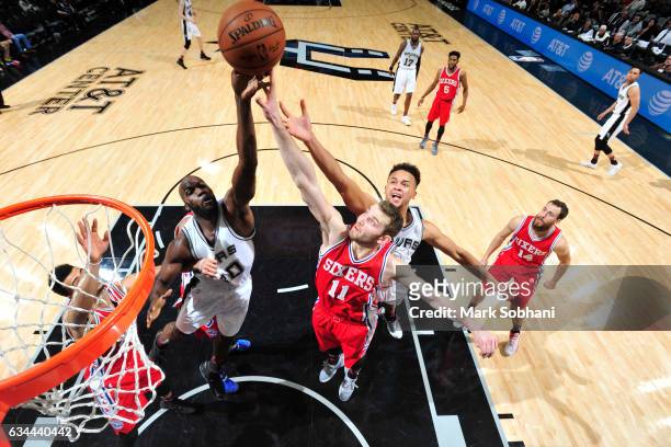 Joel Anthony of the San Antonio Spurs goes up for a rebound against Nik Stauskas of the Philadelphia 76ers during a game on February 2, 2017 at the...
