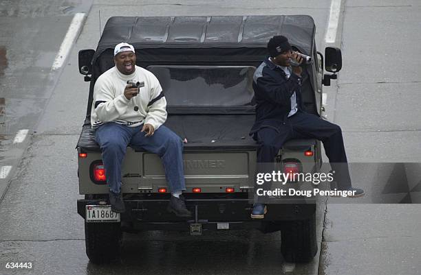 Ray Lewis, right, Superbowl MVP of the Baltimore Ravens, and a teammate videotape the crowd during the Baltimore Ravens'' victory parade through the...