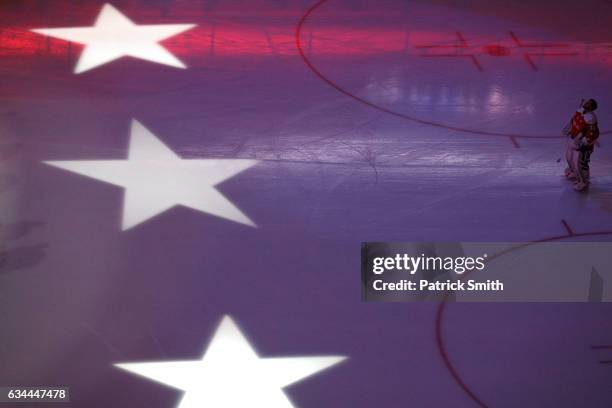 Goalie Braden Holtby of the Washington Capitals looks on during the National Anthem before playing the Detroit Red Wings at Verizon Center on...