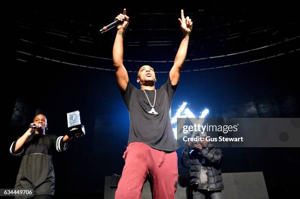 Julie Adenguna presents Wiley with an award at The Roundhouse in Camden on February 9, 2017 in London, United Kingdom.