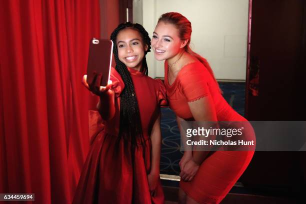 Actress Asia Monet Ray and model Iskra Lawrence attend the American Heart Association's Go Red For Women Red Dress Collection 2017 presented by...