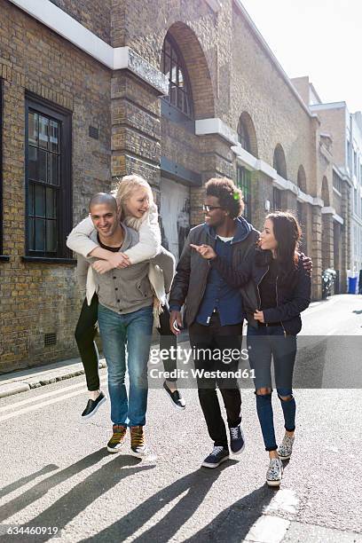 group of friends having fun on urban street - scandinavian descent stock pictures, royalty-free photos & images