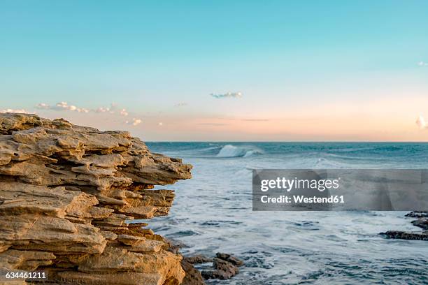 italy, sicily, ragusa, coast of punta braccetto in the evening - ragusa sicily stock pictures, royalty-free photos & images