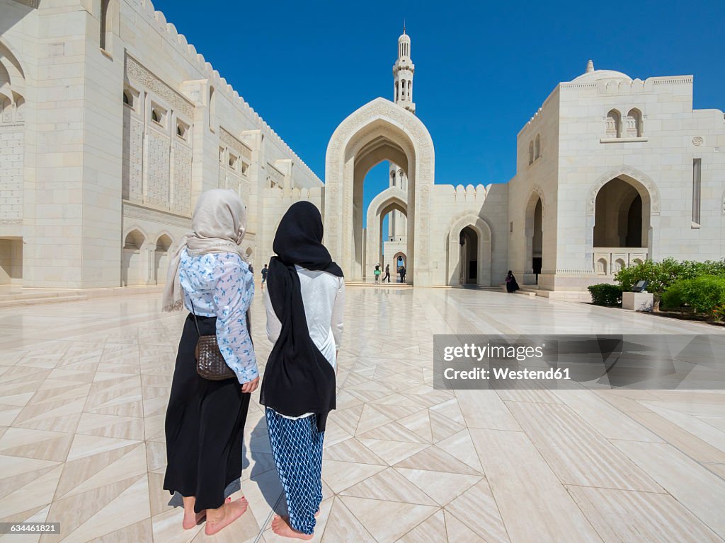 Oman, Muscat, Sultan Qaboos Grand Mosque, two female tourists with headscarf