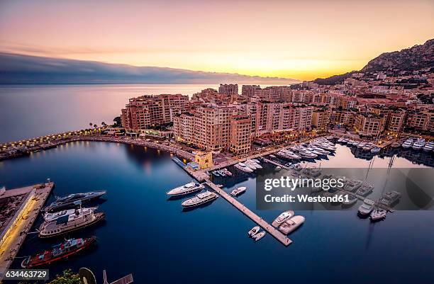 monaco, monte carlo at dusk - monte carlo harbour stock pictures, royalty-free photos & images