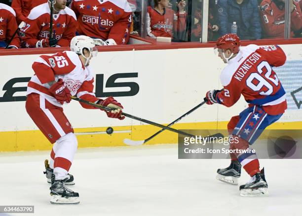 Detroit Red Wings defenseman Danny DeKeyser fights for a loose puck with Washington Capitals center Evgeny Kuznetsov in the third period on February...