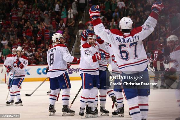 Alex Galchenyuk of the Montreal Canadiens celebrates with Greg Pateryn, Max Pacioretty and Torrey Mitchell after scoring the game winning goal...