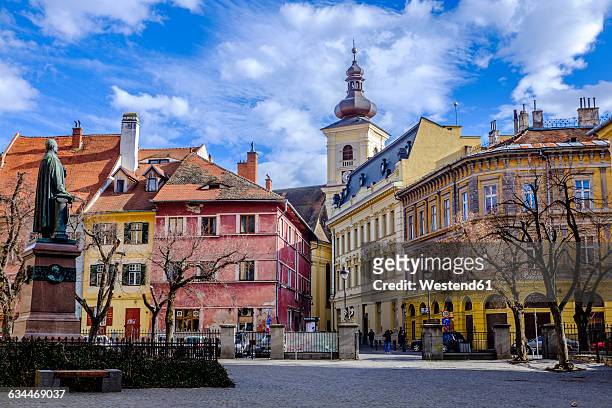 rumania, sibiu, bishop teutsch monument on square albert huet - romania stock pictures, royalty-free photos & images