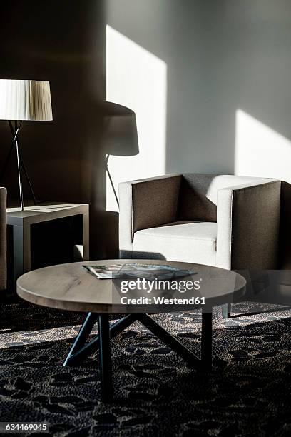 furniture in a modern hotel lobby - magazines on table stock pictures, royalty-free photos & images