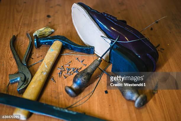 shoemaker's tools and a new leather shoe - footwear manufacturing stock pictures, royalty-free photos & images