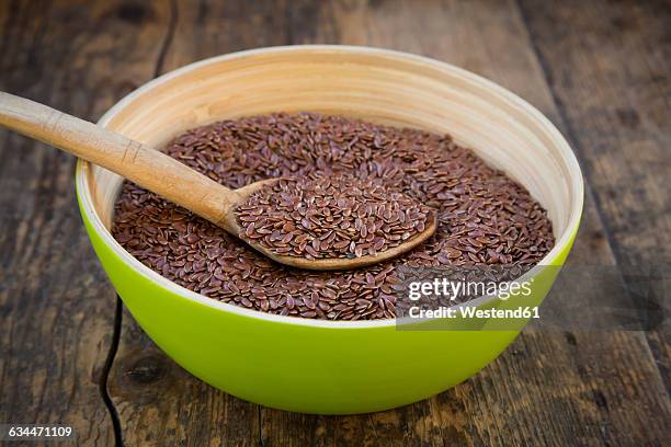 wooden bowl of organic linseed - flax seed stock pictures, royalty-free photos & images