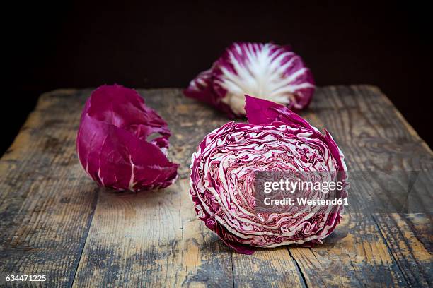 sliced radicchio rosso di chioggia on wood - radicchio ストックフォトと画像