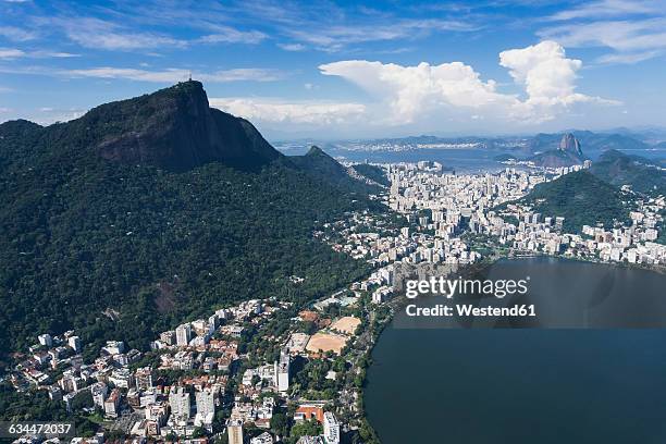 brazil, aerial view of rio de janeiro, corcovado mountain with statue of christ the redeemer - rio de janeiro aerial stock pictures, royalty-free photos & images