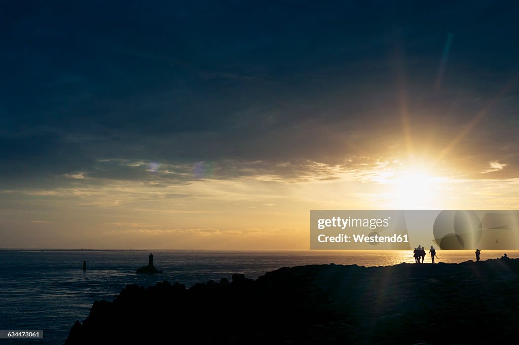 France, Brittany, Pointe du Raz, sunset at the coast with lighthouses Phare de la Vieille and Phare de Tevennec