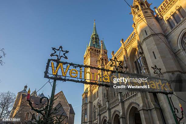 germany, braunschweig, christmas market sign at townhall in the evening - braunschweig stock pictures, royalty-free photos & images