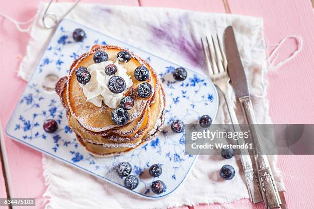 stack of american pancakes with whipped cream and blueberries - crepe textile fotografías e imágenes de stock