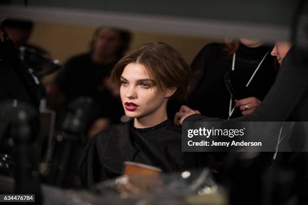 Model prepares backstage during the La Perla show during New York Fashion Week at SIR Stage 37 on February 9, 2017 in New York City.