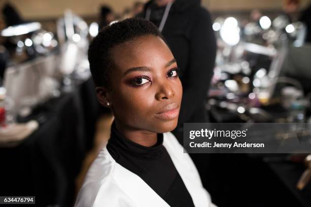 Model prepares backstage at the La Perla show during New York Fashion Week at SIR Stage 37 on February 9, 2017 in New York City.