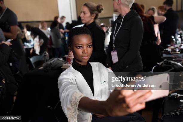 Model prepares backstage at the La Perla show during New York Fashion Week at SIR Stage 37 on February 9, 2017 in New York City.