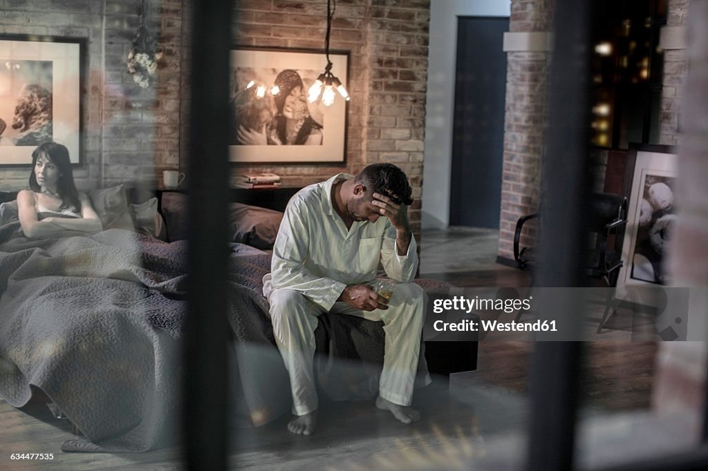 Couple in bedroom having an argument