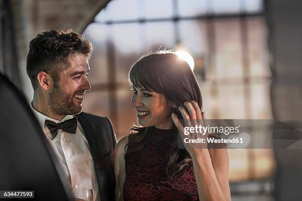 smiling couple in elegant clothing - abendgarderobe stock-fotos und bilder