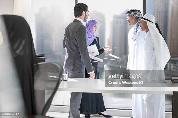 western businessman meeting middle eastern businessmen - west asia stock pictures, royalty-free photos & images