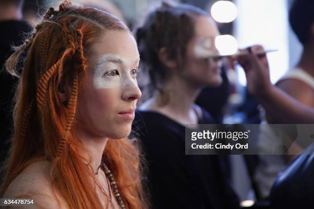 Model prepares backstage at the Berenik Presentation during New York Fashion Week on February 9, 2017 in New York City.