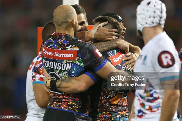 Players from the indigenous All Stars celebrate a try during the NRL All Stars match between the 2017 Harvey Norman All Stars and the NRL World All...