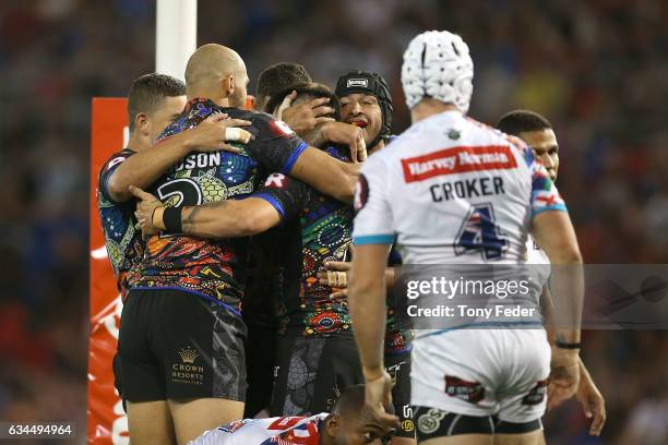 Players from the indigenous All Stars celebrate a try during the NRL All Stars match between the 2017 Harvey Norman All Stars and the NRL World All...