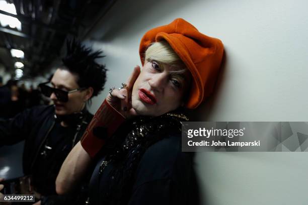 Kiss and designer Richie Rich prepare backstage during the Popoganda By Richie Rich during New York Fashion Week at The Theater at Madison Square...
