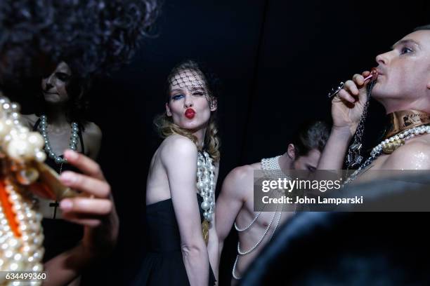 Models prepare backstage during the Popoganda By Richie Rich during New York Fashion Week at The Theater at Madison Square Garden on February 9, 2017...