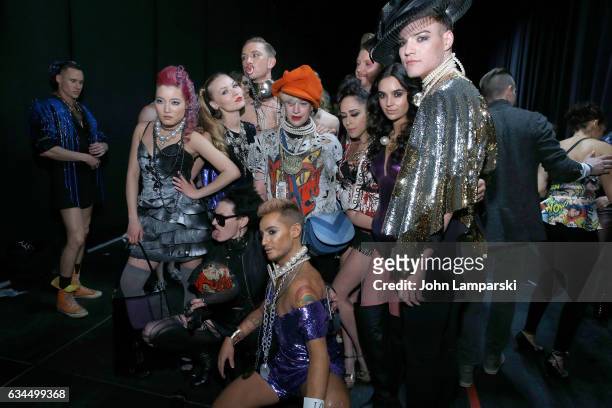 Designer Richie Rich poses with models backstage during the Popoganda By Richie Rich during New York Fashion Week at The Theater at Madison Square...