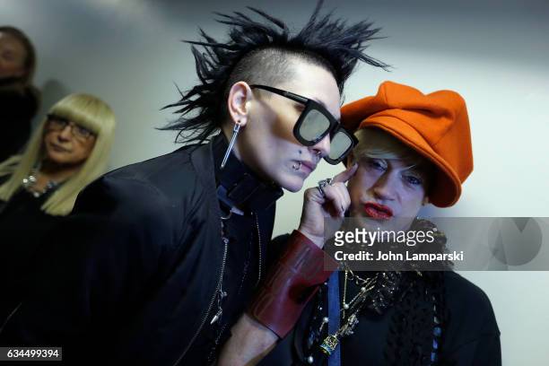 Kiss and designer Richie Rich prepare backstage during the Popoganda By Richie Rich during New York Fashion Week at The Theater at Madison Square...