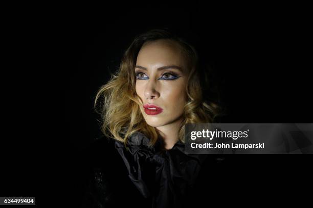 Models prepare backstage during the Popoganda By Richie Rich during New York Fashion Week at The Theater at Madison Square Garden on February 9, 2017...