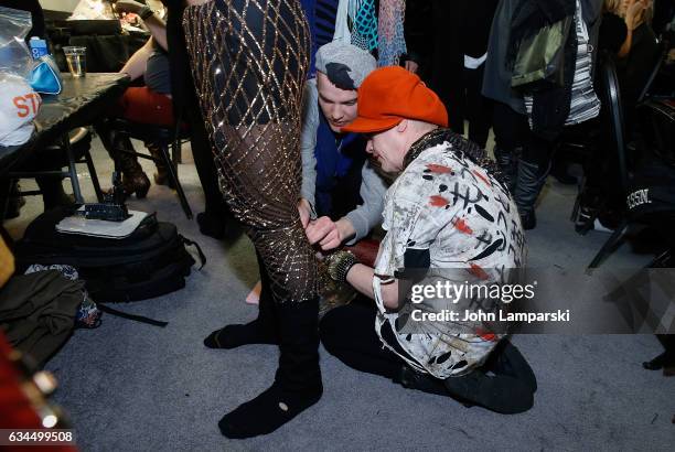 Designer Richie Rich prepares backstage during the Popoganda By Richie Rich during New York Fashion Week at The Theater at Madison Square Garden on...