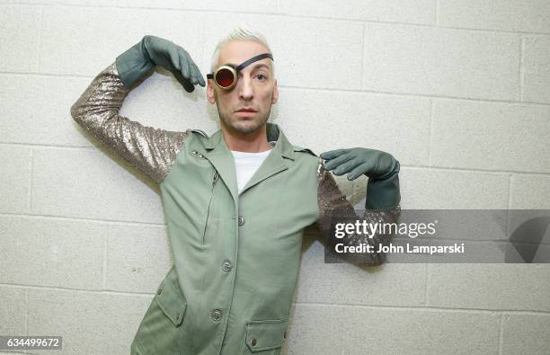 Kenn Gray prepares backstage during the Popoganda By Richie Rich during New York Fashion Week at The Theater at Madison Square Garden on February 9,...