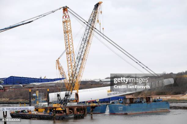 Operations begin as the final 100 metre centrepiece of Sunderland's new River Wear crossing is gradually lifted into position on February 10, 2017 in...