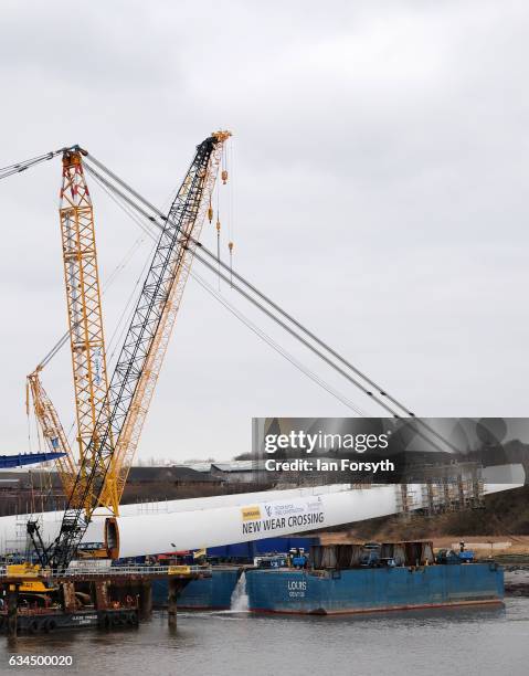 Operations begin as the final 100 metre centrepiece of Sunderland's new River Wear crossing is gradually lifted into position on February 10, 2017 in...