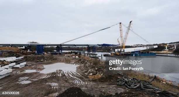 Operations begin as the final 100 metre centrepiece of Sunderland's new River Wear crossing is gradually lifted into position on February 10, 2017 in...